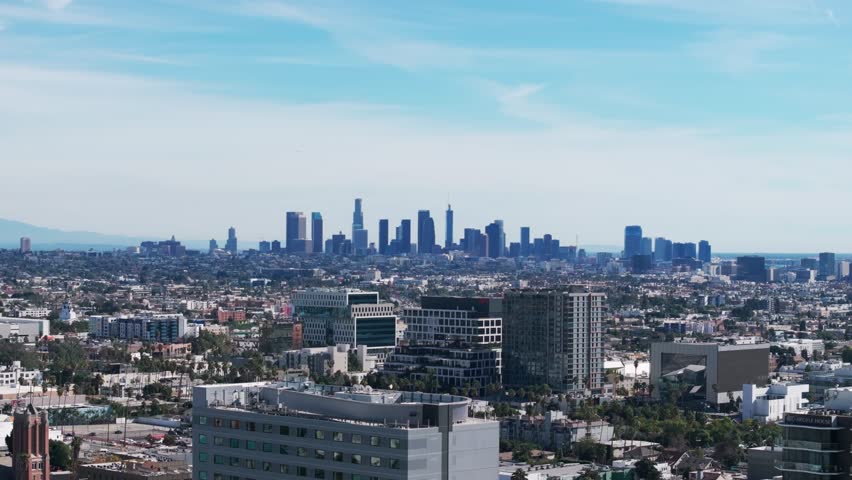 Drone shot panning to the left of the LA skyline in California