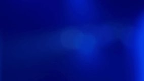Abstract blurred background with colors in shades of blue, with moving lights flashing like those of a music concert. Real time video. - Powered by Shutterstock - Get 15% off with code: PIKWIZARD15