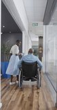 Vertical video of african american business people with disabled man talking in slow motion. Global business, finances and office concept.