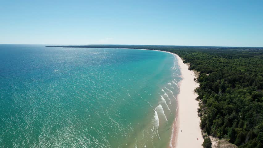 Drone shot panning to the left of whitefish dunes state park in door county, Wisconsin