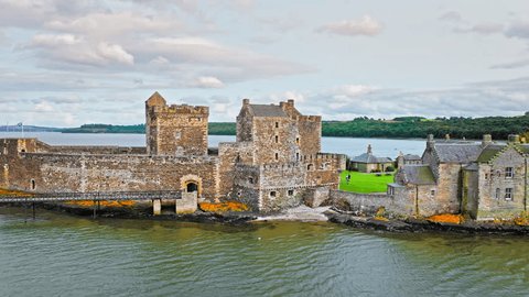 Aerial view of Blackness Castle, shiplike form fortress in  Blackness, Scotland. Castle with rampart views stands on a rocky spit in the Firth of Forth, Scotland.の動画素材