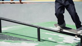 Skateboarder doing trick and crossing in front of camera