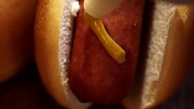 Preparing Hot Dog with Mustard and Ketchup. 4K Video
