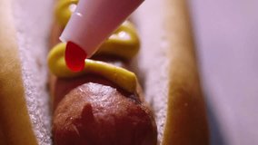 Preparing Hot Dog with Mustard and Ketchup. 4K Video