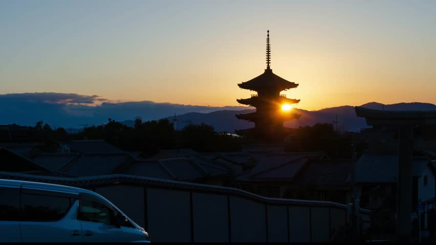 timelapse kyoto city aerial skyline view to ancient Yasaka pagoda building and Kyoto Tower at the back in higashiyama, Kyoto old town with sunset sky ,famous landmark building in Kyoto japan Royalty-Free Stock Footage #3456590735