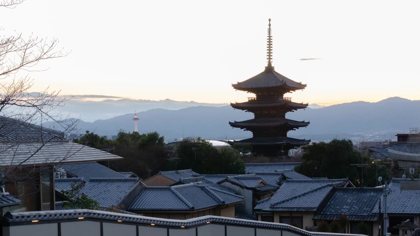 timelapse kyoto city aerial skyline view to ancient Yasaka pagoda building and Kyoto Tower at the back in higashiyama, Kyoto old town with sunset sky ,famous landmark building in Kyoto japan Royalty-Free Stock Footage #3456591097