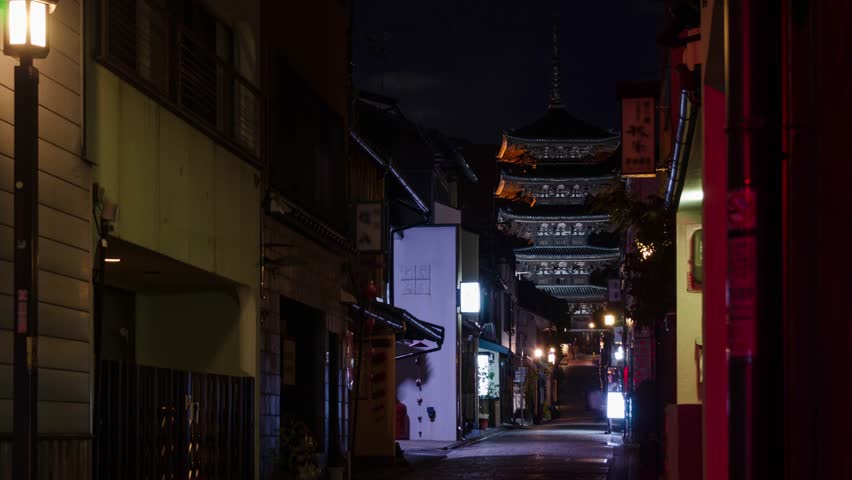 night time lapse view of local street with some traffic and people leads to ancient Yasaka pagoda building at higashiyama in Kyoto old town city ,famous landmark building in Kyoto japan Royalty-Free Stock Footage #3456591339