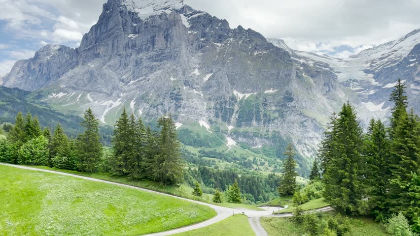 Grindelwald and First is beatiful Swiss village surrounded by towwering peaks. From iconic Eiger North Face tp exhilarating adventure at First, 