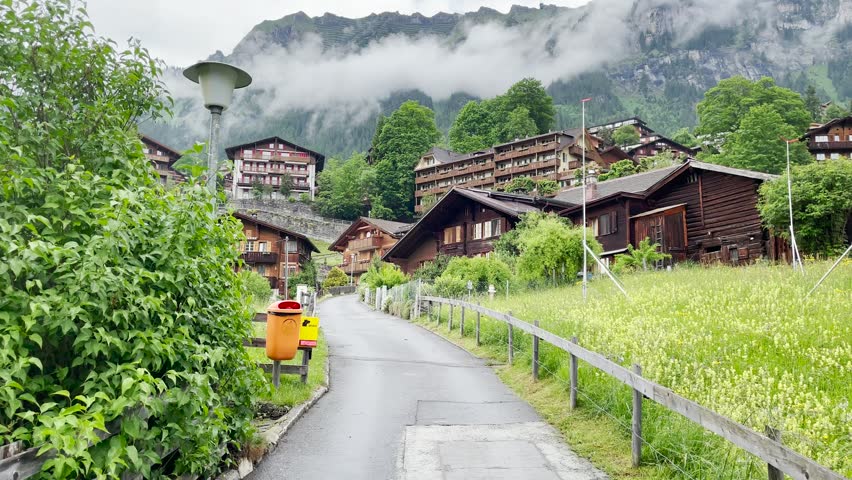 Timeless beauty of Wengen, Switzerland alpine village with panoramic mountains, Wengen offers a picturesque escape for every season.  Royalty-Free Stock Footage #3456637971