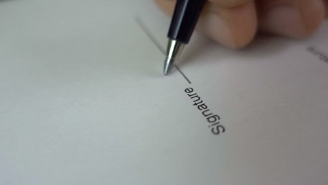 Businessman signing business contract agreement, close up of male hand with pen writing signature