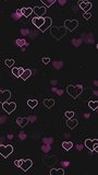Abstract dark romantic vertical motion background with animated pink heart shape particles pulsating on black backdrop. Decorative gothic video animation for romantic love party or Valentine's day.