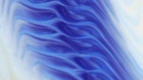 Moving natural background in the style of abstract art. The blue tone in the marble pattern. Abstract texture in white and blue tones. Flowing, ever-changing liquid abstraction, slow motion, beautiful