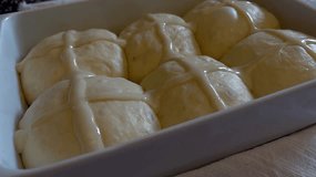 Raw hot cross buns in a baking pan - Powered by Shutterstock - Get 15% off with code: PIKWIZARD15