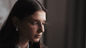 Close up of tired woman working on laptop, girl in eye glasses with reflections overworking busy, using computer in office - Powered by Shutterstock - Get 15% off with code: PIKWIZARD15