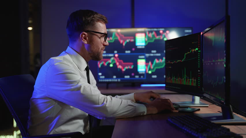 Stressed cryptocurrency trader look at monitor screen shows the financial market chart graphic going down. Market crash, scam, bear market Royalty-Free Stock Footage #3456808359
