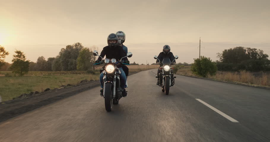 Friends travel on motorcycles. 4k follow shot