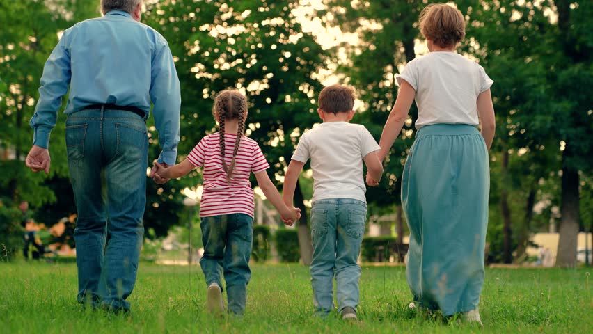 Weekend play, holiday kids, Children and parents run together on green grass. Family game, father mother daughter son fun running in park. Happy family team. Children dream, mom dad children in nature Royalty-Free Stock Footage #3456838533