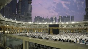 Muslims perform their worship at the Holy Kaaba Stock Video Footage. Muslim, Arabia, Pilgrim, praying, Mecca, perform acts of worship, Hajj, hajj stock