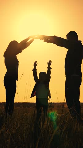 Family play Silhouette. Happy family mother father daughter, son, kid, dream to build house, mortgage for family. Happy family shows house with their hands, symbol of safety, comfort for child, sunset Royalty-Free Stock Footage #3456848923