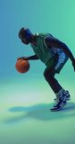 Vertical video of african american male basketball player bouncing ball on green background. Sports and competition concept.