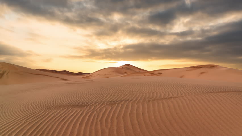 Timelapse of sunset over the sand dunes in the desert. Sahara desert