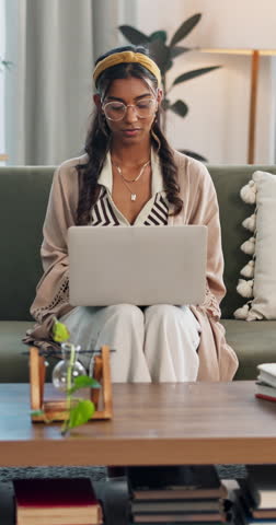 Student, laptop or Indian woman in e learning, online education and typing for university. Remote work, computer or female person on couch to research information or report on a college website