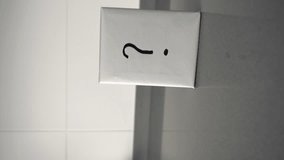 Mystery gift box with a question mark on a grey surface. Vertical shot - Powered by Shutterstock - Get 15% off with code: PIKWIZARD15