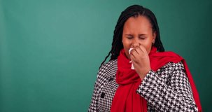 Short video of African woman feeling sick, sneezing and rubbing her nose