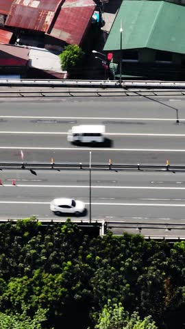 Top view of Highway in Makati with vehicles. Metro Manila. Philippines. Vertical view.