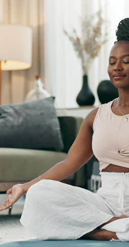 Home, yoga and meditation with black woman, health and fitness with wellness, lotus and chakra. African person, yogi and girl with peace, exercise or calm with training, apartment or zen with workout Royalty-Free Stock Footage #3457145811