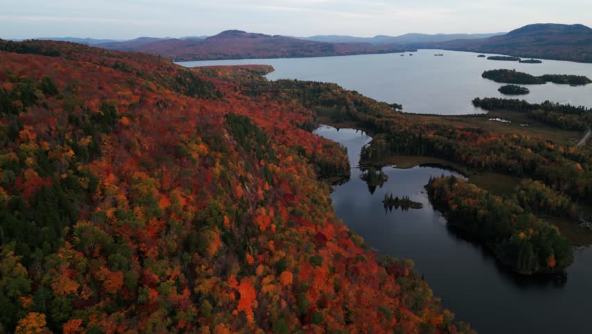 aerial shot over typical canadian landscape during fall in Quebec, Mont Sourire and Lake Ouareau, autumn, Quebec province, Canada