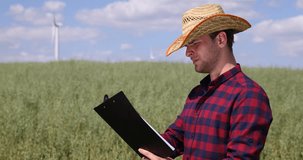 Oat Field Cultivator Man Checking Data Clipboard Examining Plantation Activity