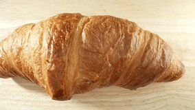 Croissant: Popular French pastry, flaky, buttery, crescent-shaped. Layered dough rolled or folded for delicate, airy interior and crisp, golden-brown layers outside. Fast-food background. 4K HDR. 
 - Powered by Shutterstock - Get 15% off with code: PIKWIZARD15