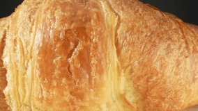 The croissant's delicate yet indulgent flavor and texture make it a beloved pastry in the culinary world, embodying the perfect balance of simplicity and sophistication. Food background. 4K UHD.
