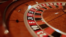 Red color casino roulette, poker game. roulette wheel. Casino theme, betting, online casino, bets, winnings. Luxury casino roulette wheel with ball. close-up video - Powered by Shutterstock - Get 15% off with code: PIKWIZARD15