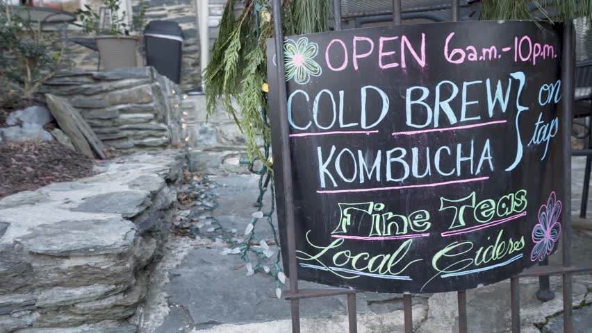 Steadicam gimbal motion orbit of sign for cold brew kombucha on tap and fine teas and local ciders.