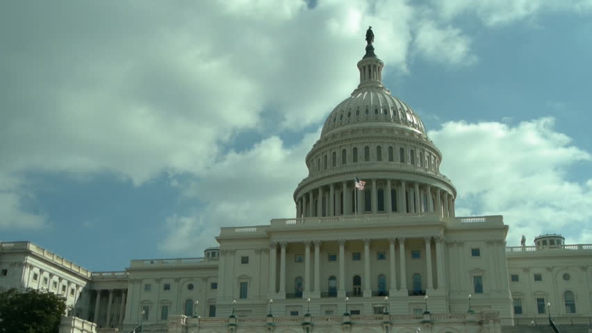 US Capitol on cloudy sky background