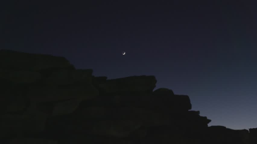 Crescent Moon Above Rock Wall at Night. Texas, USA. Winter 2023