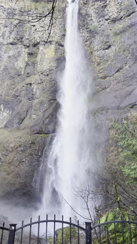 Close-up of the roaring Multnomah Falls from the Multnomah Creek Bridge on a February day.
