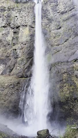 Close-up of the roaring Multnomah Falls from the Multnomah Creek Bridge on a February day.
