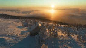Santa's cabin on the Levitunturi fell, winter sunrise in Finland - Aerial view - Powered by Shutterstock - Get 15% off with code: PIKWIZARD15