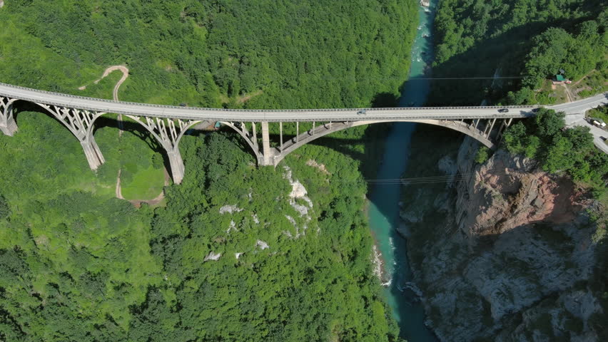 Aerial tilt view on Djurdjevica arch bridge over the Tara River in northern Montenegro, 4k Royalty-Free Stock Footage #3457313843