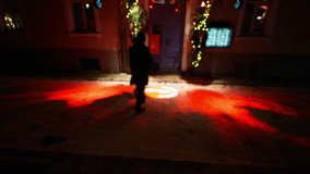 A person walks through a decorated doorway with Christmas lights - Powered by Shutterstock - Get 15% off with code: PIKWIZARD15