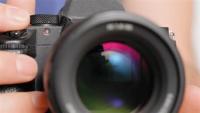 Digital camera in low-light adjusting the electronic autofocus and aperture to take a picture - isolated close up - Powered by Shutterstock - Get 15% off with code: PIKWIZARD15