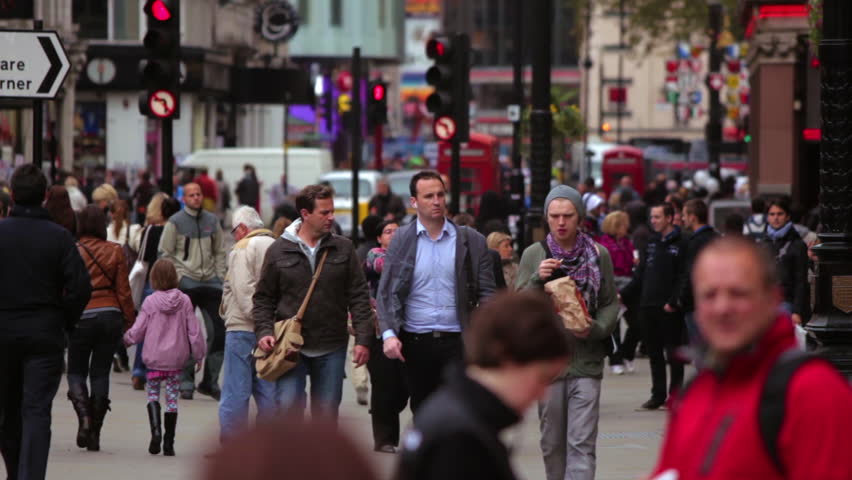 LONDON - OCTOBER 7, 2011: Traffic and unidentified people on a street in the day