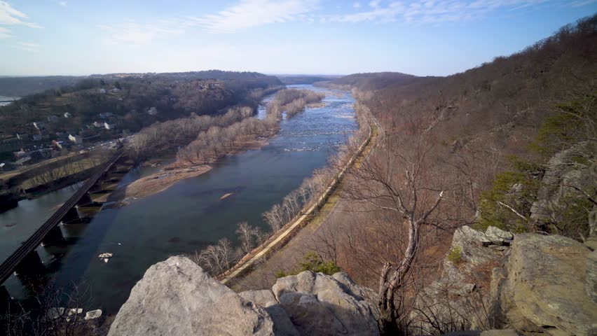 Very slow pan to the left view of Harpers Ferry National Park and the confluence of the Potomac and Shenandoah Rivers from Maryland Heights.