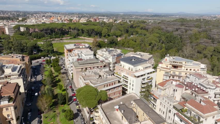 Aerial view of Villa Ada, a large public park in Rome, Italy. This large green area is located in the northern area of the city, between the Parioli, Pinciano and Trieste-Salario district. Royalty-Free Stock Footage #3457458795