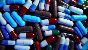 Colorful drugs, antibiotic capsules. Cure flu medication. Macro view of tablets. Pharmacy, medicine concept. Pain killer bio medicine - Powered by Shutterstock - Get 15% off with code: PIKWIZARD15