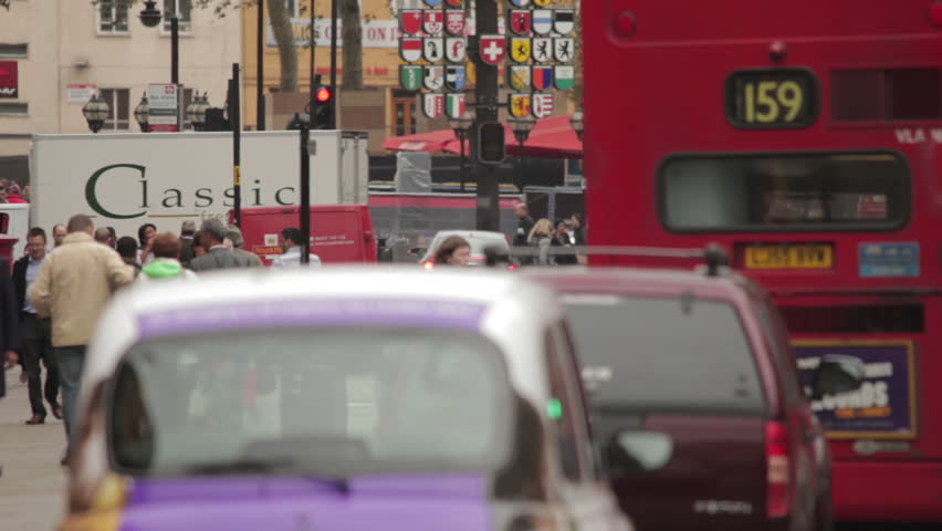 People and traffic on a busy street in London