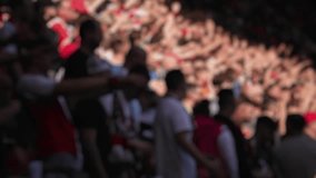 blur ,a football match in sunny weather, the stands at stadiums are filled with people, fans celebrate the victory of their team, football players train before the match, football players play footbal - Powered by Shutterstock - Get 15% off with code: PIKWIZARD15